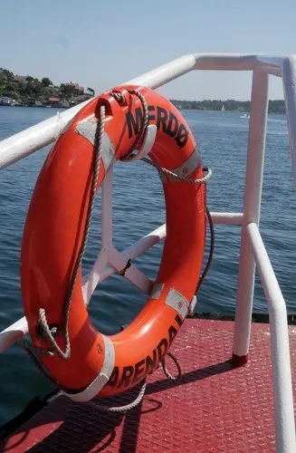 A life ring on the rail of the ferry to Merdø