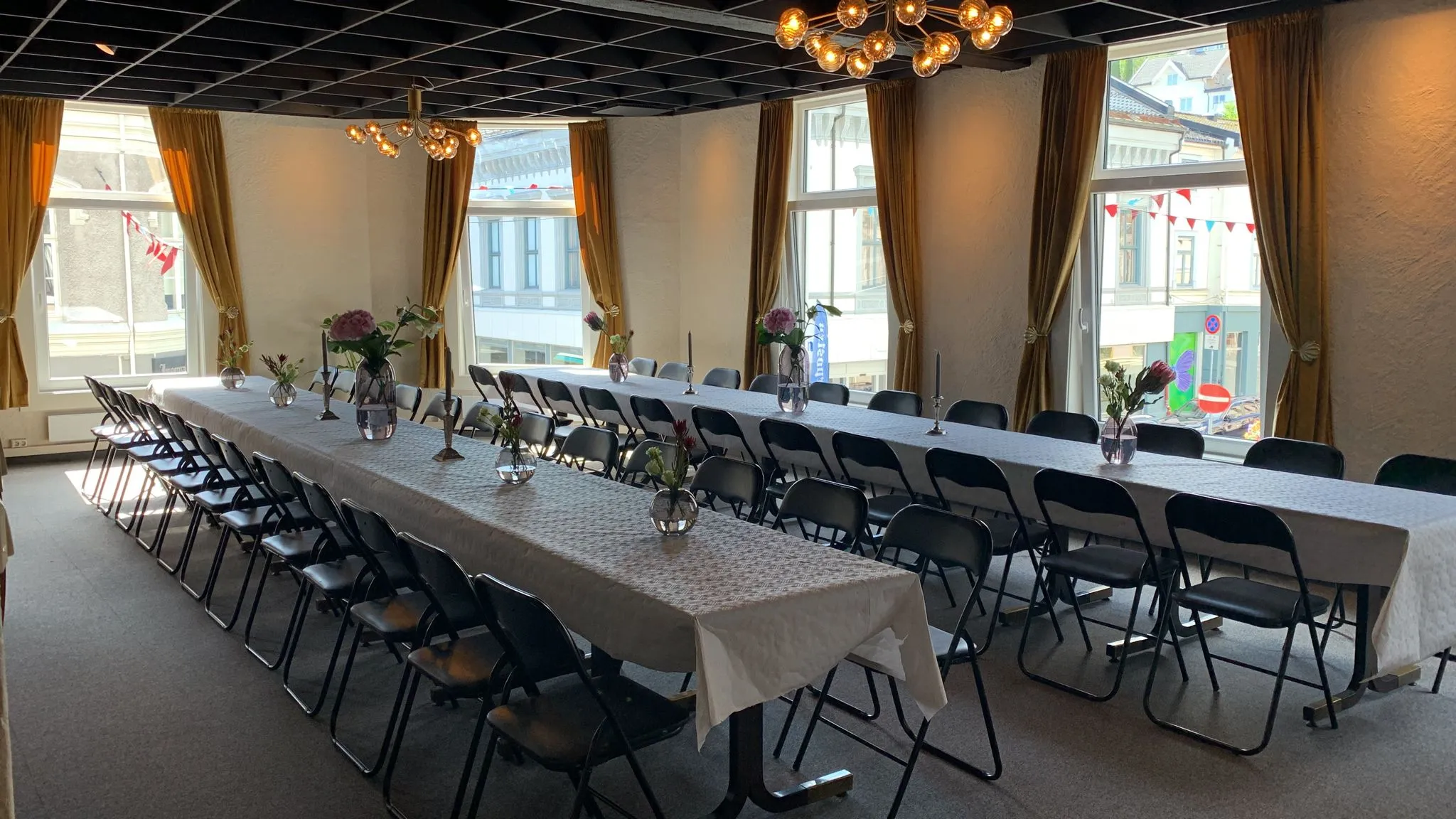 Hall 1 set for dinner with chandeliers overhead